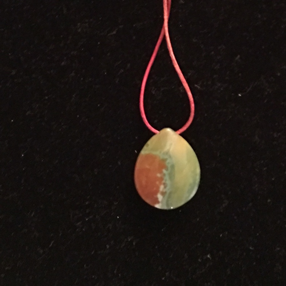 Tres Petite Jasper Teardrop on rolled leather thong - see model wearing example